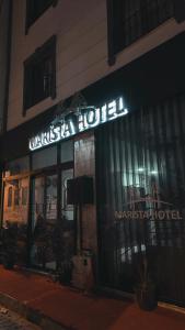 a building with a sign for a market hotel at Marista Pansiyon in Istanbul