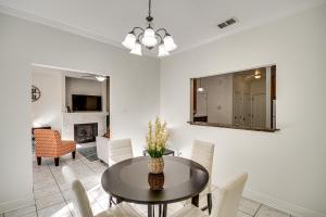 a dining room with a table and chairs at Ideally Located Gulfport Condo Less Than 1 Mi to Beach! in Gulfport