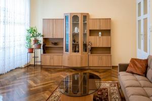 a living room with a large wooden cabinet at casa max in Timişoara