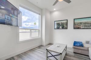 a living room with a couch and a large window at Park Blvd Paradise 301 ADA compliant with a Spa in San Diego