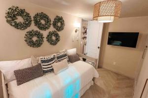 a bedroom with a bed with wreaths on the wall at Mexique in Mexico City