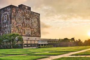 a building with a mural on the side of it at Mexique in Mexico City