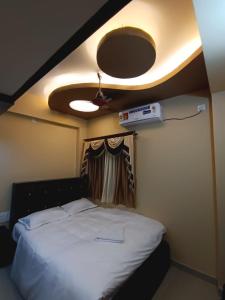 Alif serviced Apartment for Families and Executives客房内的一张或多张床位