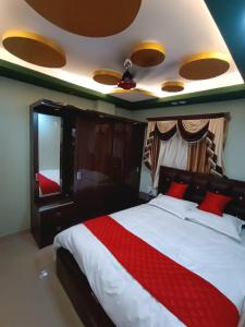 Alif serviced Apartment for Families and Executives客房内的一张或多张床位