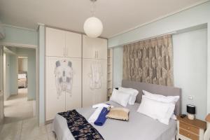 เตียงในห้องที่ Lampetos Houses Molyvos