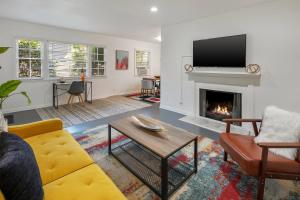 a living room with a couch and a fireplace at Quaint 1BD/1BA Bungalow- Venice Beach in Los Angeles