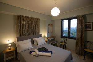 เตียงในห้องที่ Lampetos Houses Molyvos