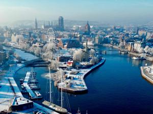 an aerial view of a harbor with boats in the water at Old Town Nadmotławie - Sauna & Gym I 10min deptak in Gdańsk