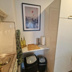 a small bathroom with a sink and a counter at Ferienwohnung mit Meerblick in Bad Zwischenahn in Bad Zwischenahn