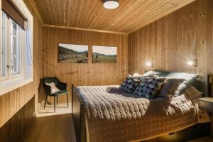 Un pat sau paturi într-o cameră la Villa Budor 1.5 time fra Oslo
