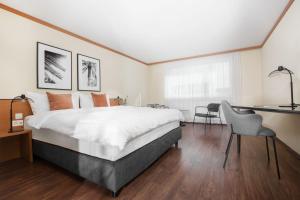 Postelja oz. postelje v sobi nastanitve HOTEL ENGEL LIESTAL - Business & Lifestyle
