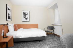 Postelja oz. postelje v sobi nastanitve HOTEL ENGEL LIESTAL - Business & Lifestyle