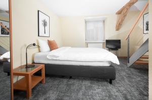 Postelja oz. postelje v sobi nastanitve HOTEL ENGEL LIESTAL - Business & Lifestyle