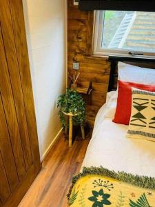 a bedroom with a bed in a room with a window at Clyde Croft - (Luxury Cabin) in Portpatrick
