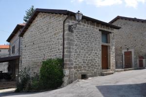 a brick building with a street light on the side of it at Agriturismo Casavecchia in Abetito +28 photos