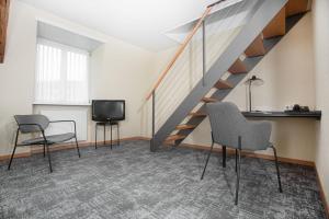 TV in/ali zabaviščno središče v nastanitvi HOTEL ENGEL LIESTAL - Business & Lifestyle