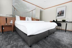 Postelja oz. postelje v sobi nastanitve HOTEL ENGEL LIESTAL - Business & Lifestyle