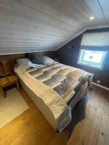 Voodi või voodid majutusasutuse Vakker hytte med fantastisk utsikt toas