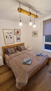 Ένα ή περισσότερα κρεβάτια σε δωμάτιο στο Apartmani Šišarka Jahorina