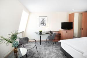 Postelja oz. postelje v sobi nastanitve HOTEL ENGEL LIESTAL - Business & Lifestyle