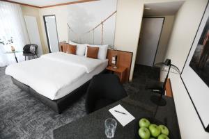 Postelja oz. postelje v sobi nastanitve HOTEL ENGEL LIESTAL - Business & Lifestyle