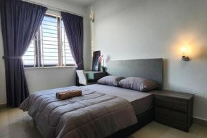 a bedroom with a large bed and a large window at JC Sky Riverfront 'Nebula' in Kota Bharu
