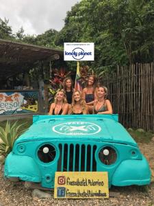 a group of women standing on alatablelatable rhino at Freesoul Hostel in Palomino