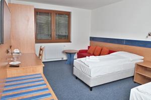 Letto o letti in una camera di Hotelový dům Kaskáda - Bed and Breakfast