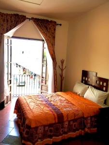 Ένα ή περισσότερα κρεβάτια σε δωμάτιο στο Hostal Santuario de las Libelulas