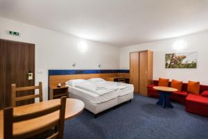 Letto o letti in una camera di Hotelový dům Kaskáda - Bed and Breakfast