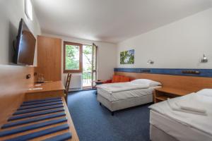 Postel nebo postele na pokoji v ubytování Hotelový dům Kaskáda - Bed and Breakfast + 33 fotografií