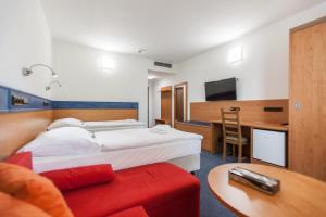 Letto o letti in una camera di Hotelový dům Kaskáda - Bed and Breakfast