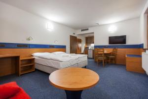 Letto o letti in una camera di Hotelový dům Kaskáda - Bed and Breakfast