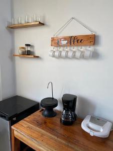 a kitchen with a counter with a coffee maker on it at habitación cerca a playa man in San Cristobal