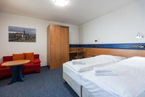 Letto o letti in una camera di Hotelový dům Kaskáda - Bed and Breakfast