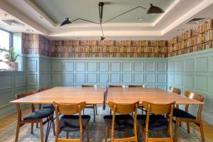 a conference room with a wooden table and chairs at U Street 1br w gym nr metro nightlife WDC-710 in Washington