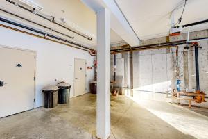 an empty room with two trash cans in a building at Black Diamond #2B in Whitefish +22 photos