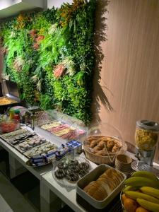 a table with a bunch of different types of food at Premium Residence in Braşov