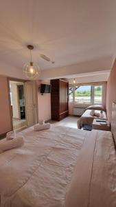 a large bedroom with two beds and a television at Robinson Alojamientos - Edificio Erico Orlando in Ushuaia