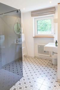 a bathroom with a shower and a sink at Haus Grün in Niederstetten