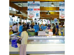 a group of people standing at a counter in a store at Kesennuma Plaza Hotel - Vacation STAY 15381v in Kesennuma