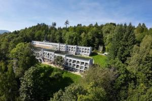 an aerial view of a building in the woods at Apartament By Miło Było in Ustroń