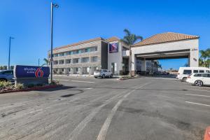 a gas station with cars parked in a parking lot at Studio 6 Suites Perris, CA in Perris