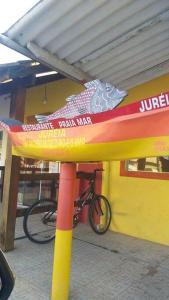 a bike parked in front of a building at Casa em Iguape praia da Juréia in Iguape