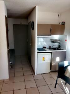 Kuchyň nebo kuchyňský kout v ubytování Appartement