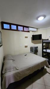 Säng eller sängar i ett rum på Prédio Atalaia - Praia Grande Arraial do Cabo