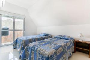ภาพในคลังภาพของ Duplex vista para o mar na praia dos Açores ในฟลอเรียนอโปลิส