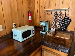 a microwave sitting on top of a kitchen counter at Lakeshore Resort in Lakeshore