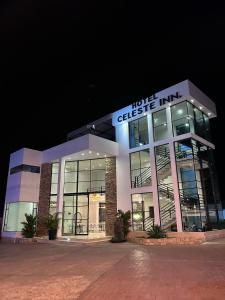 a building with the words wolf checkin inn on it at Hotel Celeste Inn Chinauta- Fusagasugá in Chinauta