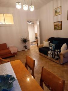 a living room with a couch and a table at Apartamenty - MI Stare Miasto in Warsaw